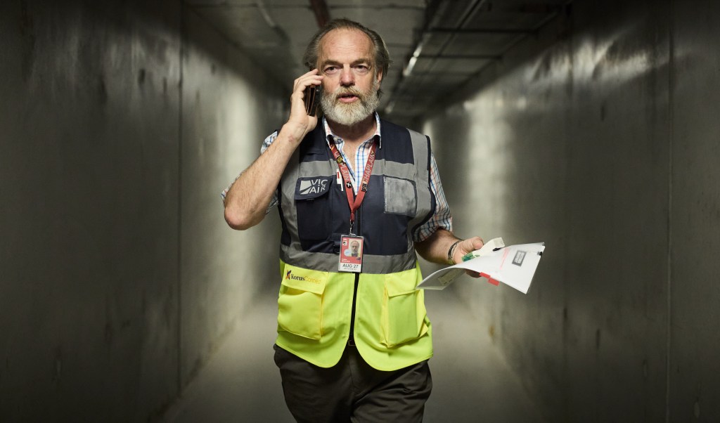 The Airport Chaplain Netflix deal sends Hugo Weaving drama worldwide