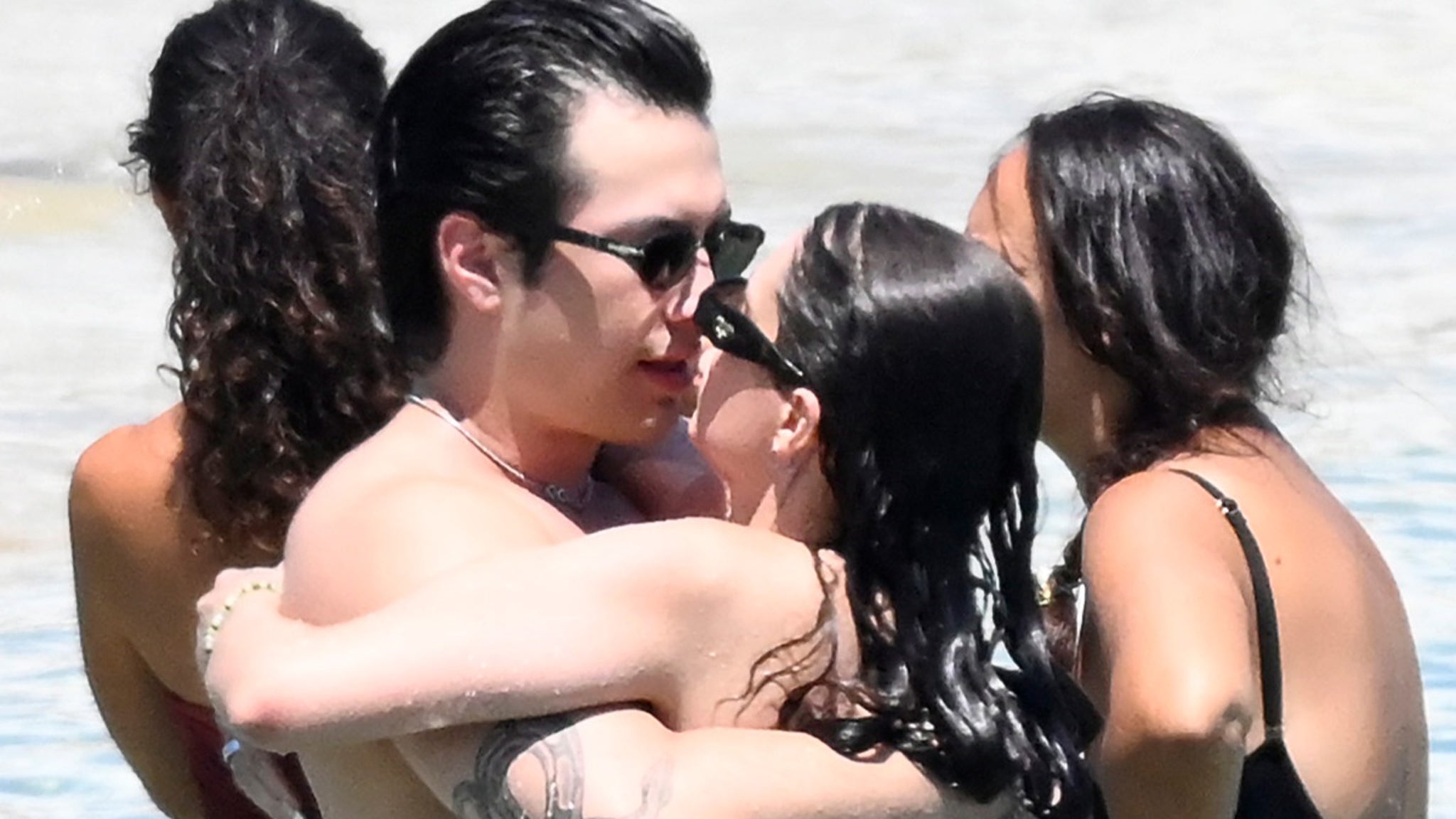 Hudson Williams and Katelyn Larson turn Greek beach day into PDA fest